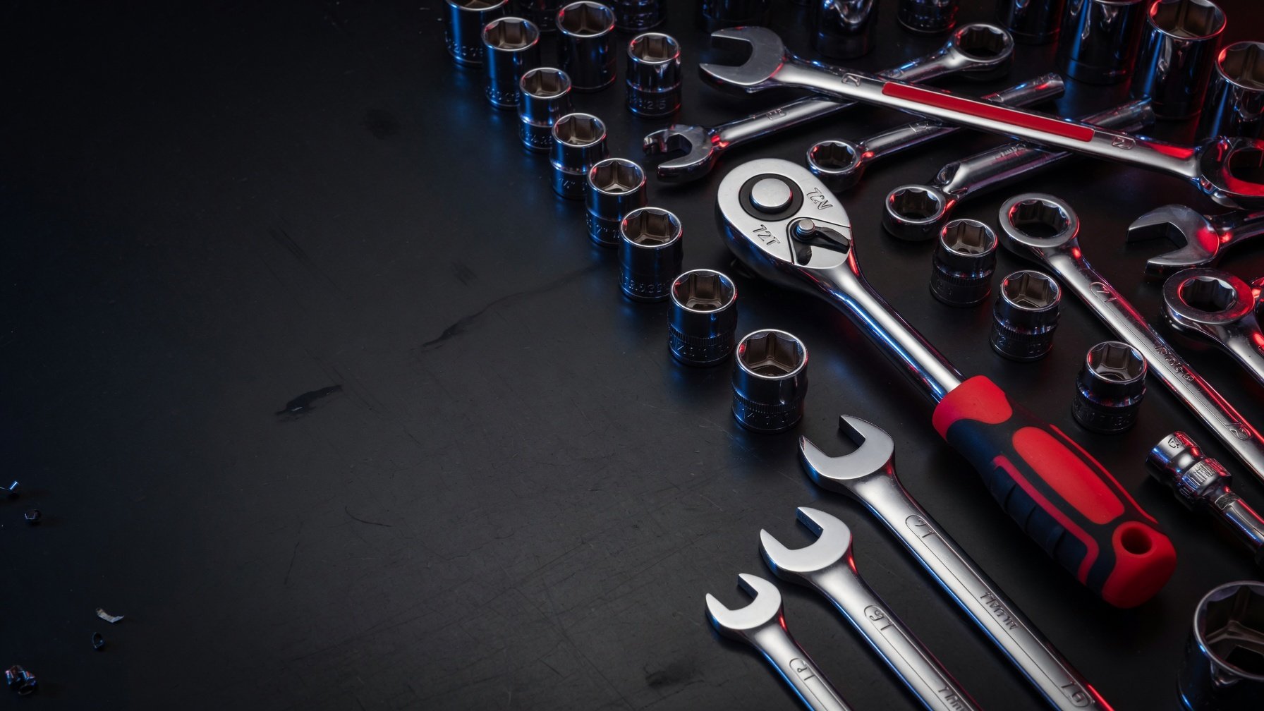 Drop-forged wrenches and sockets arranged on steel